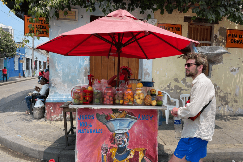 a juice cart on a street in Colombia