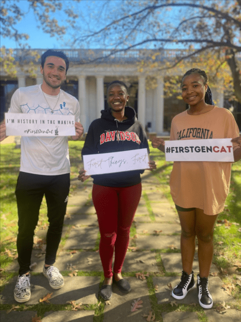 Students Holding First Gen Signs