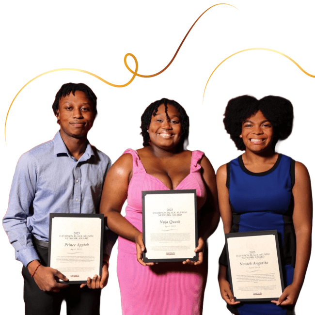 three young Black people holding awards