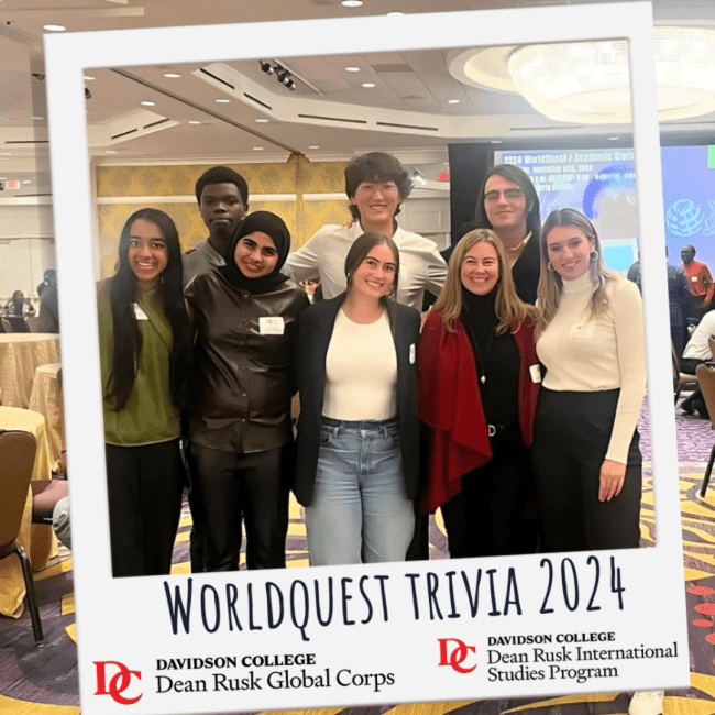 a group of students standing together at an event smiling