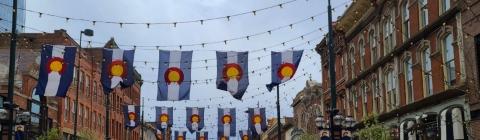 Colorado Flags hanging in an alley