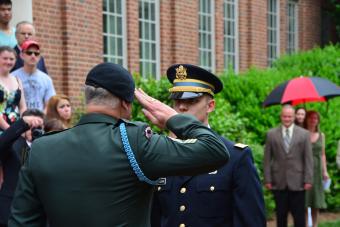 Military official salutes ROTC student outside
