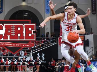 Kellan Grady Dribbles Ball During Basketball Game, CARE logo is overlaid
