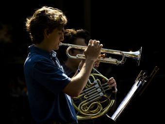 two students playing brass instruments