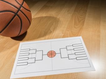 Image of basketball and brackets sheet for March Madness