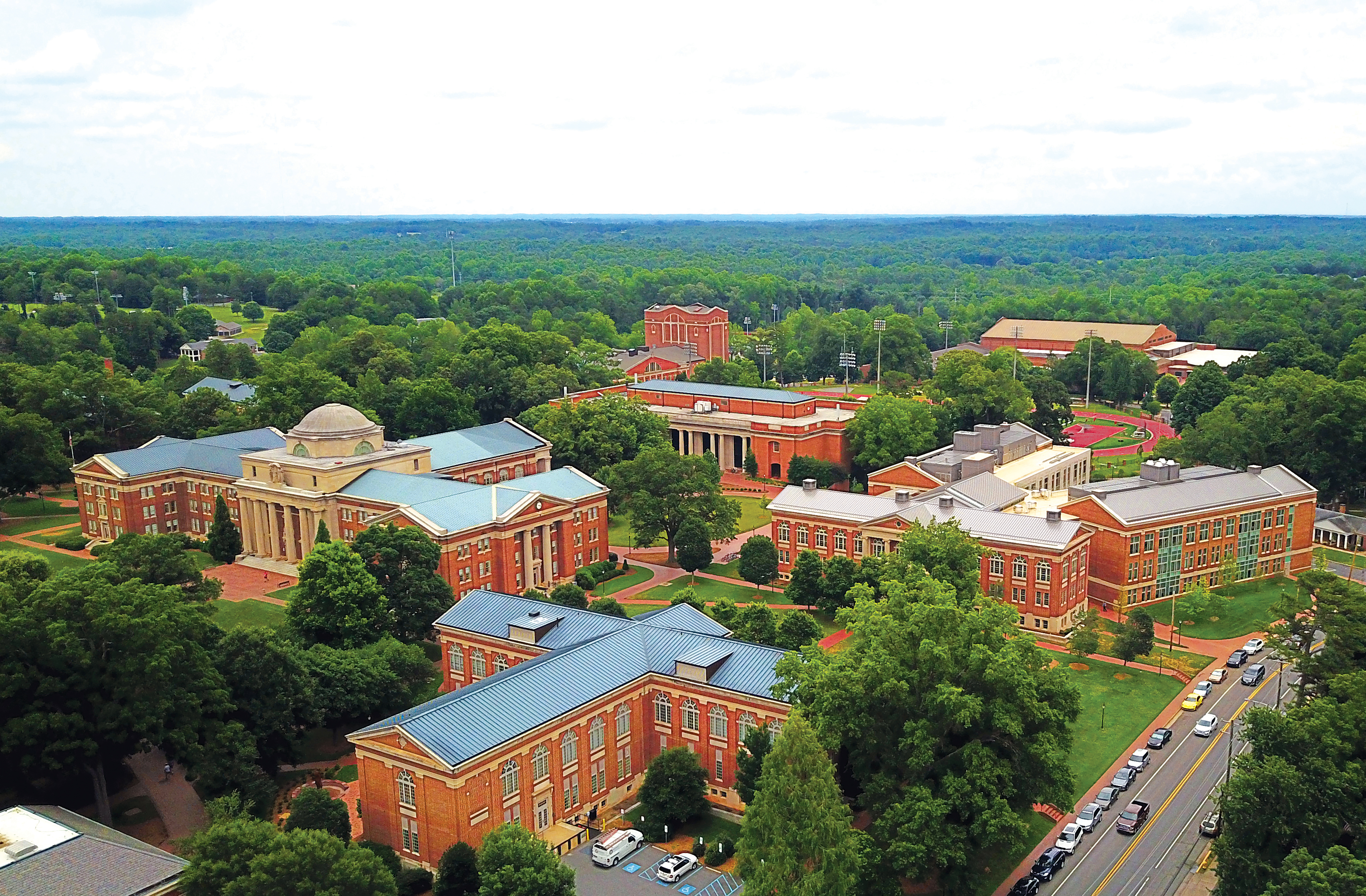 Aerial of Davidson College campus showing lots of campus buildings and trees