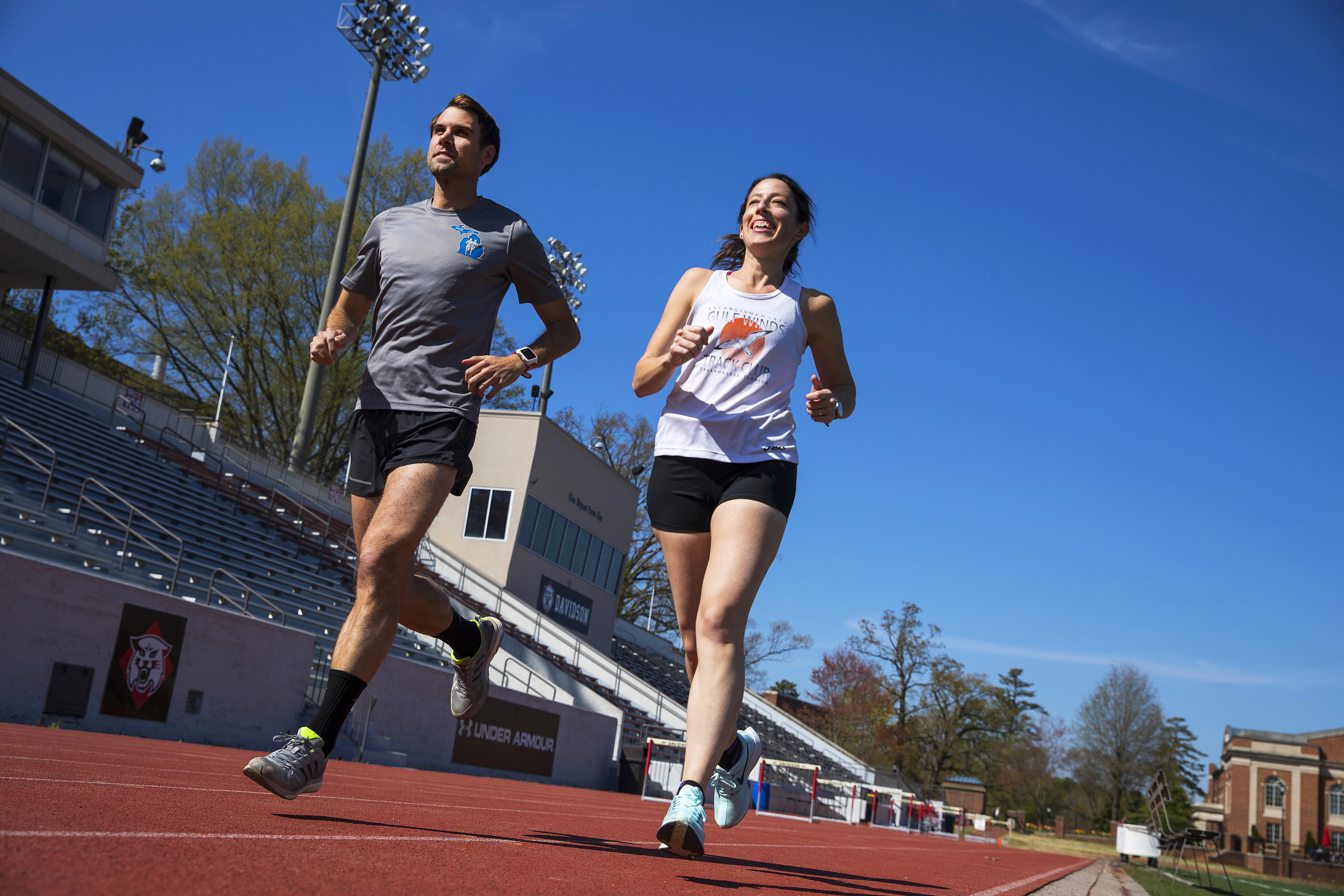 Two physics professors run on the track