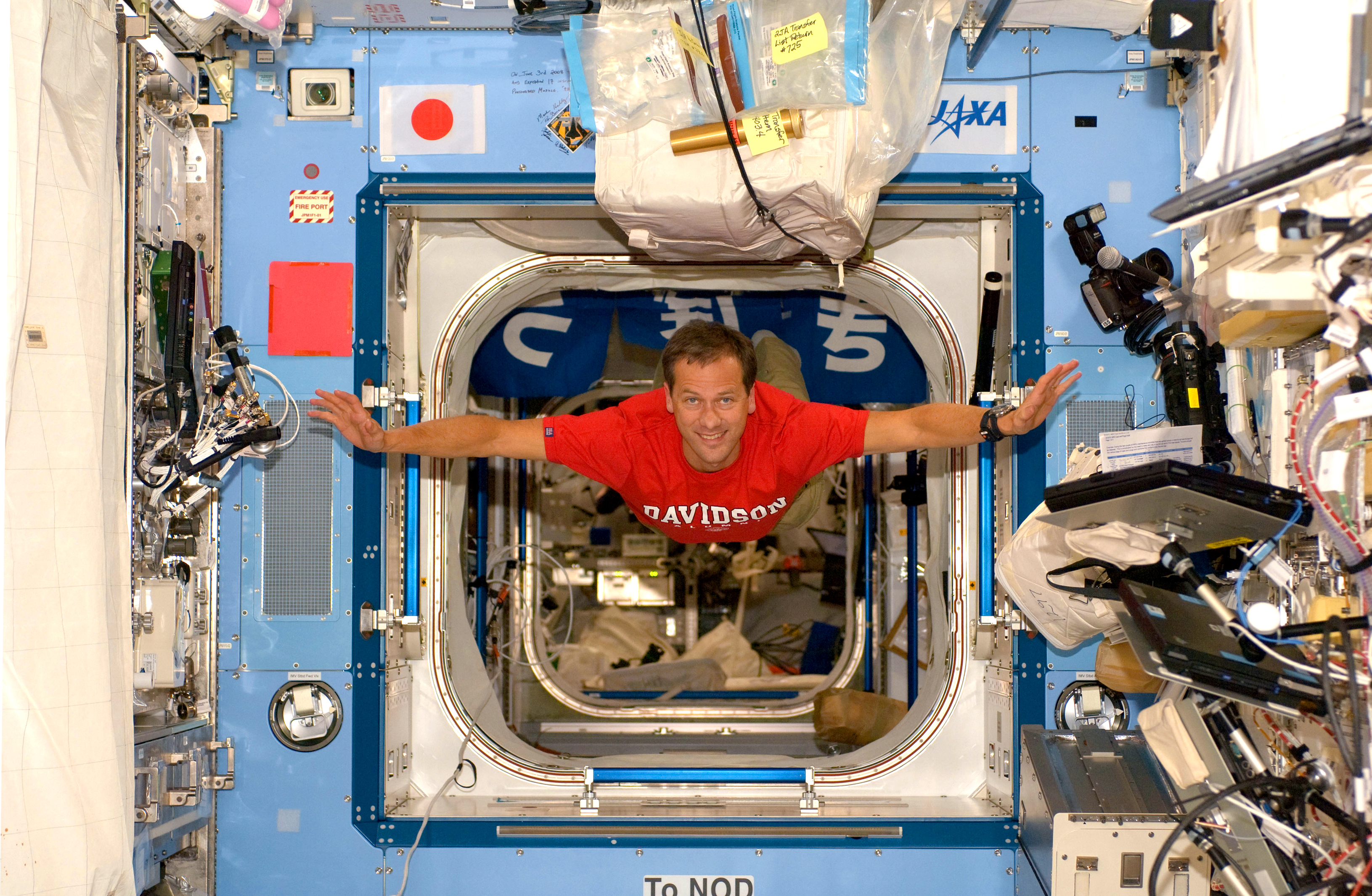 Tom Marshburn in spaceship with Davidson t-shirt on