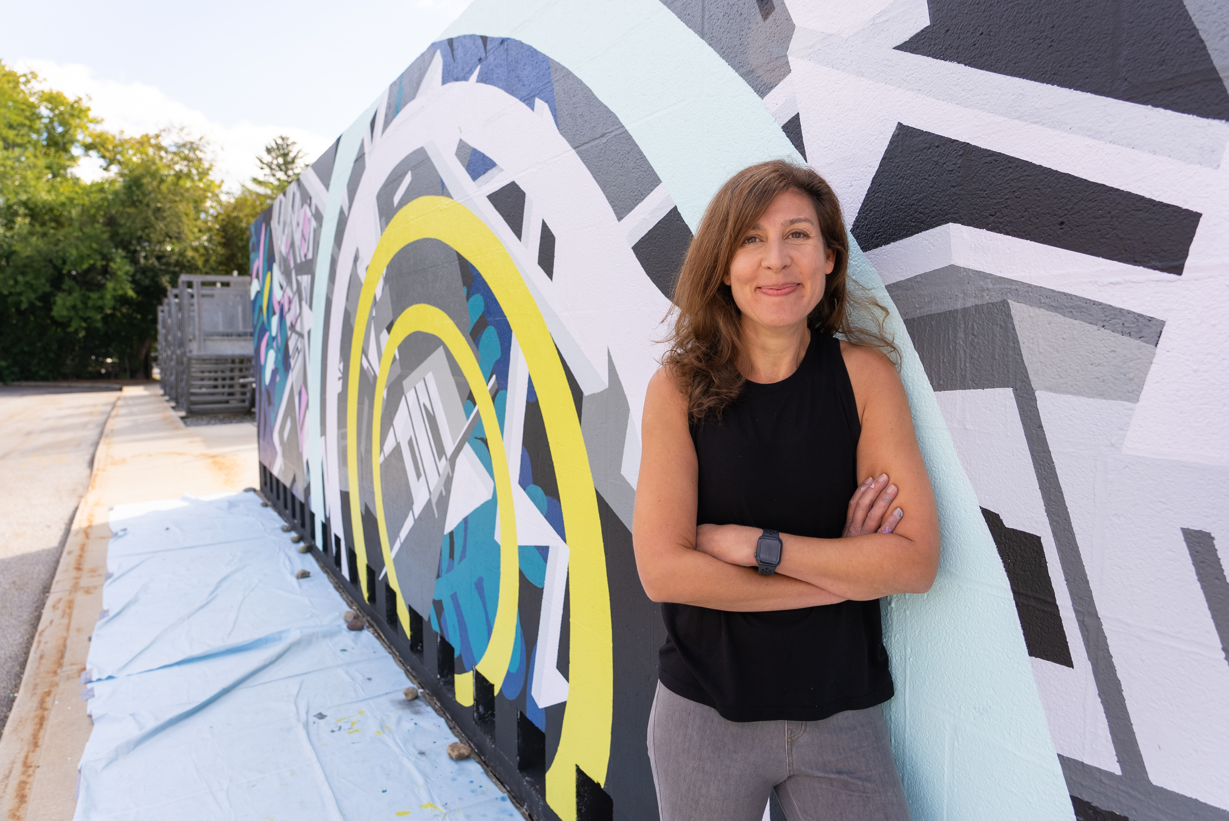 Davidson College Prof. Joelle Dietrick poses by mural project at Dickinson College