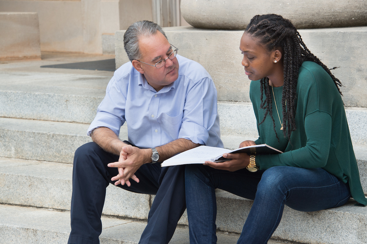 Prof. Samuel Sánchez y Sánchez converses with student