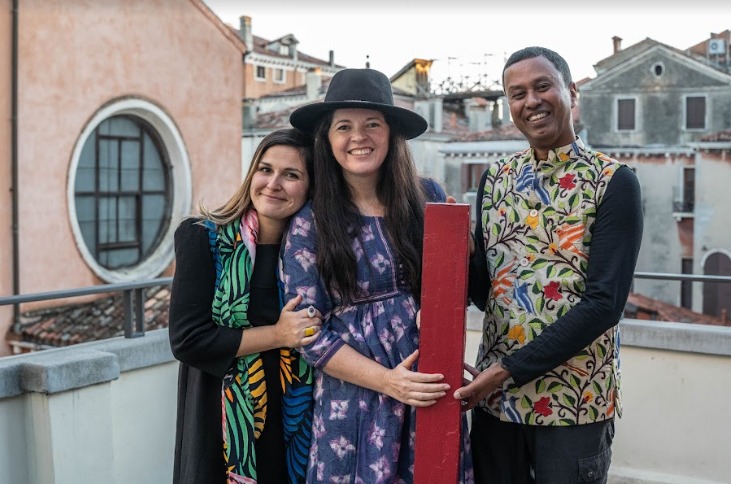 Co-curators Jennifer Garcia Peacock (center) and Subhankar Banerjee with Lucia Pedrana, head of university relations, European Cultural Centre, Venice, celebrate their award for A Library, a Classroom, and the World, at a Nov. 27 ceremony. 