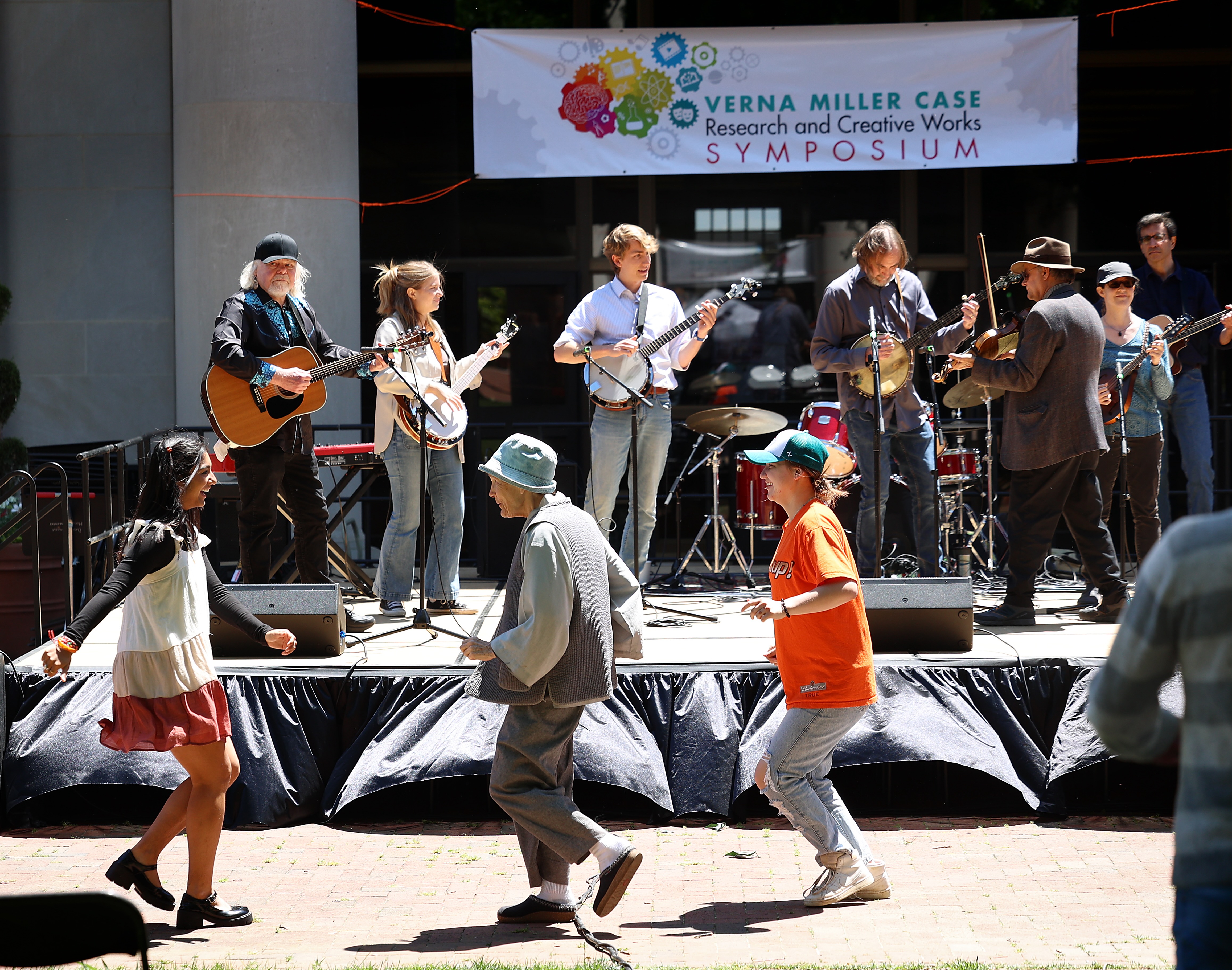 scenes of people dancing in front of a band