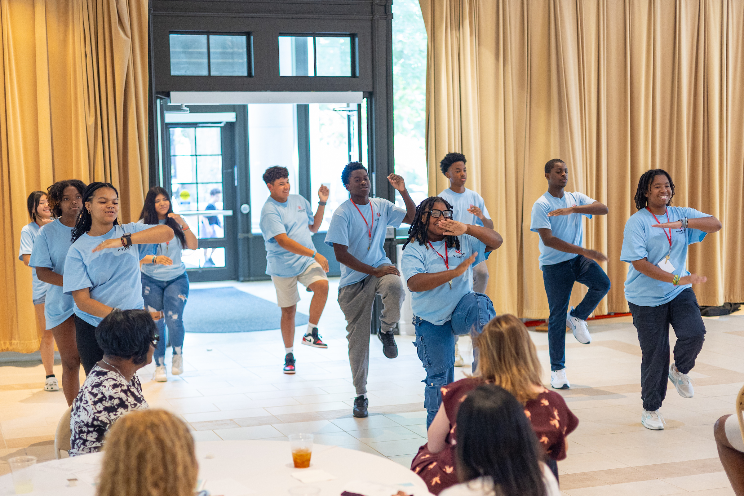 Summer Promise participants learning step to teach coding concepts