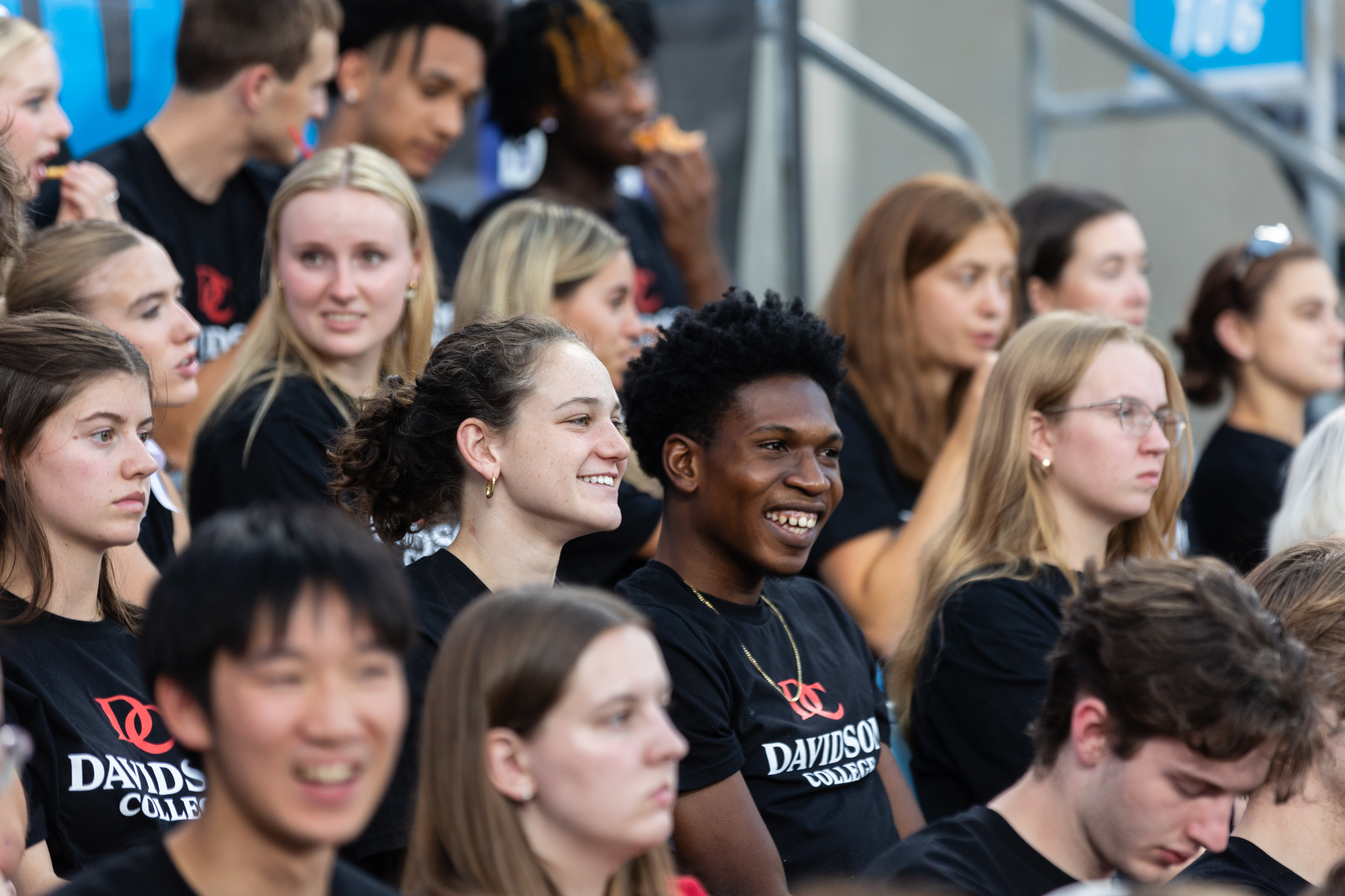 Students smiling at the Charlotte FC game