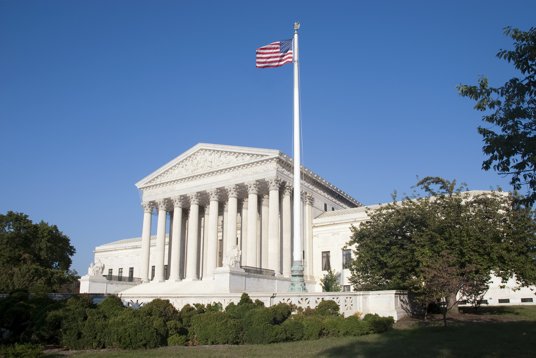 Supreme Court Building will American flag in front