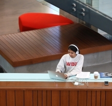 Student working at laptop in Wall Center