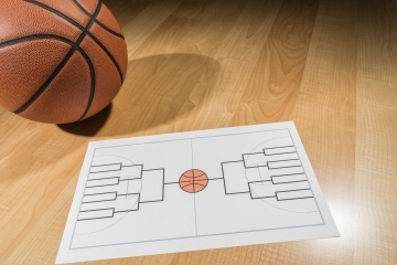 Image of basketball and brackets sheet for March Madness