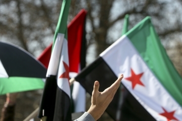 Syrian flags in a crowd