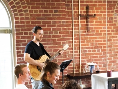 Christian Student Organization with someone playing guitar