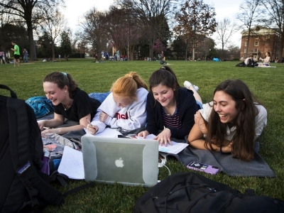 Students on Front Lawn w Computer Warm Day