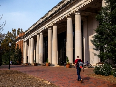 E.H.Little Library Exterior with student walking in