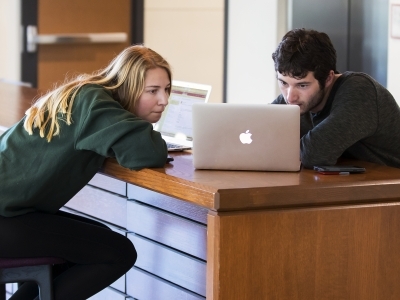 Students Looking at Laptop Studying