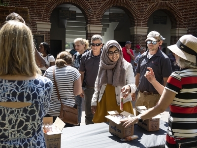 Employees of Davidson get popsicles on a hot day during an employee appreciation event