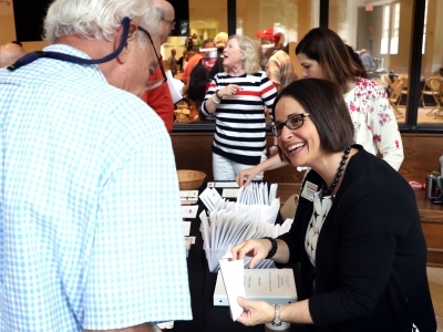 Judith Rowles Greeting Alumni at College Event