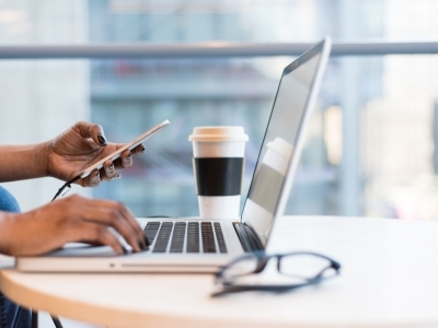 Employee w laptop and coffee