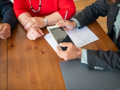 People signing papers