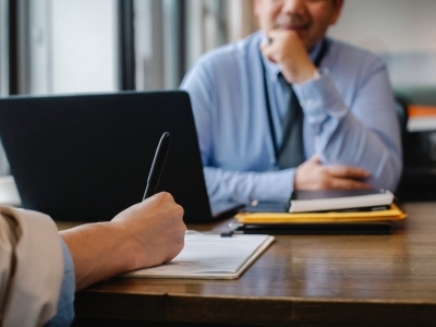 A meeting around a laptop