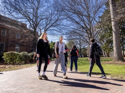 Two students walk together on campus