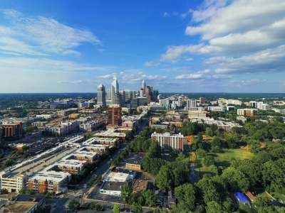 a view of the Charlotte skyline on a sunny blue skies day