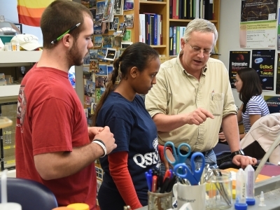 Professor Malcolm Campbell with students in the lab