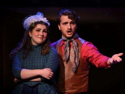 Students singing during Carousel performance