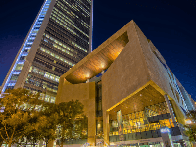 a modern structure lit up at night