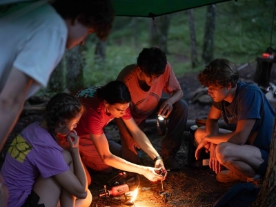 Students starting dinner at a camping trip