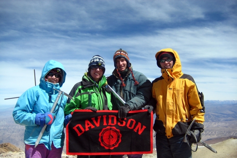 Davidson Flag with Students in Chachani Peru