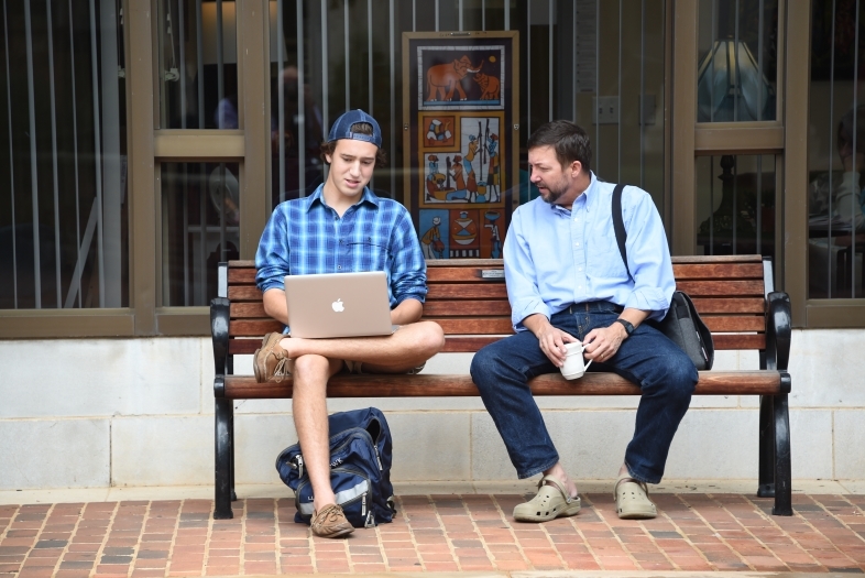 Prof Krentz with Student on a Bench