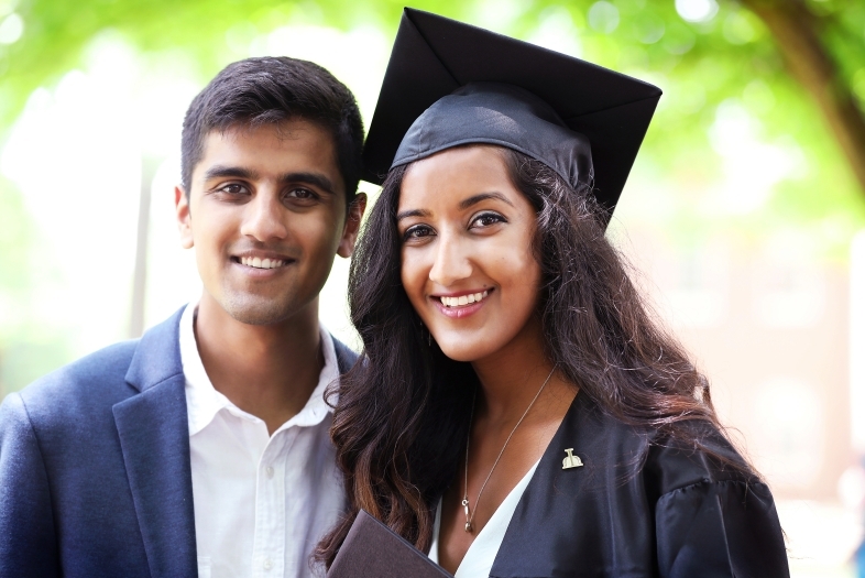 Student poses with family member for portrait