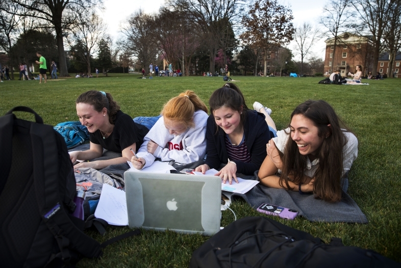 Students on Front Lawn w Computer Warm Day