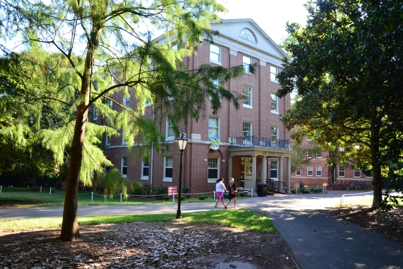 Little Dorm exterior with students walking by