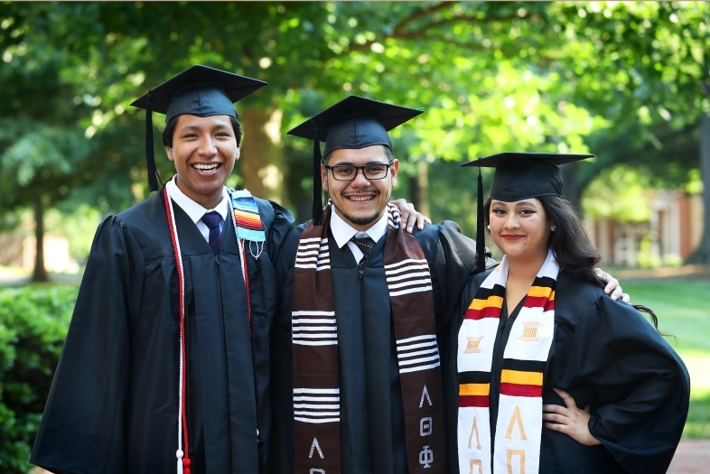 Charles Scholars pose in regalia