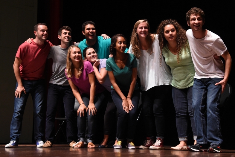 Health Advisers Group poses on stage