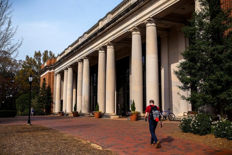 E.H.Little Library Exterior with student walking in