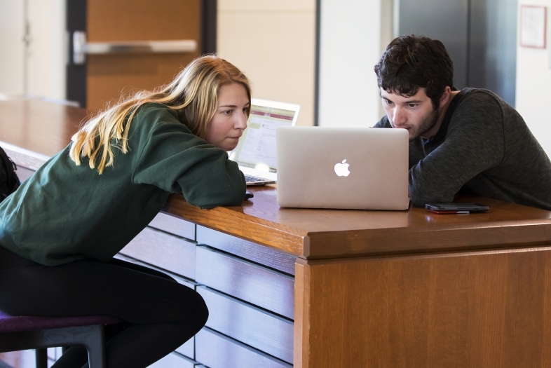 Students Looking at Laptop Studying