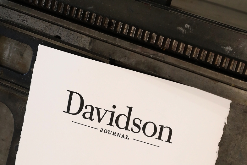 Paper with the "Davidson Journal" wordmark printed on it atop a letterpress