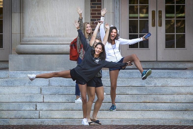 Students with Arms in the Air Celebrating on Chambers Steps