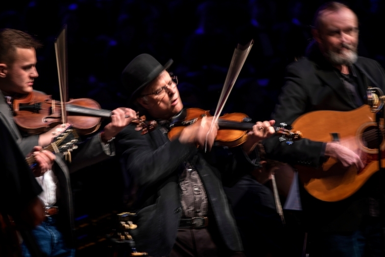 appalachian ensemble of three men playing string instruments