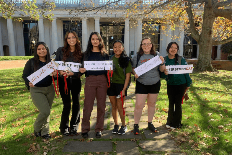 Students Holding First Gen Signs